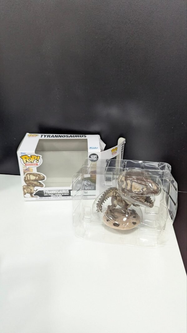 Figura Funko Pop tiranosaurio Rex en caja.
