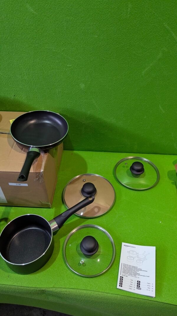 Juego de sartenes y cazos con tapas y manual.