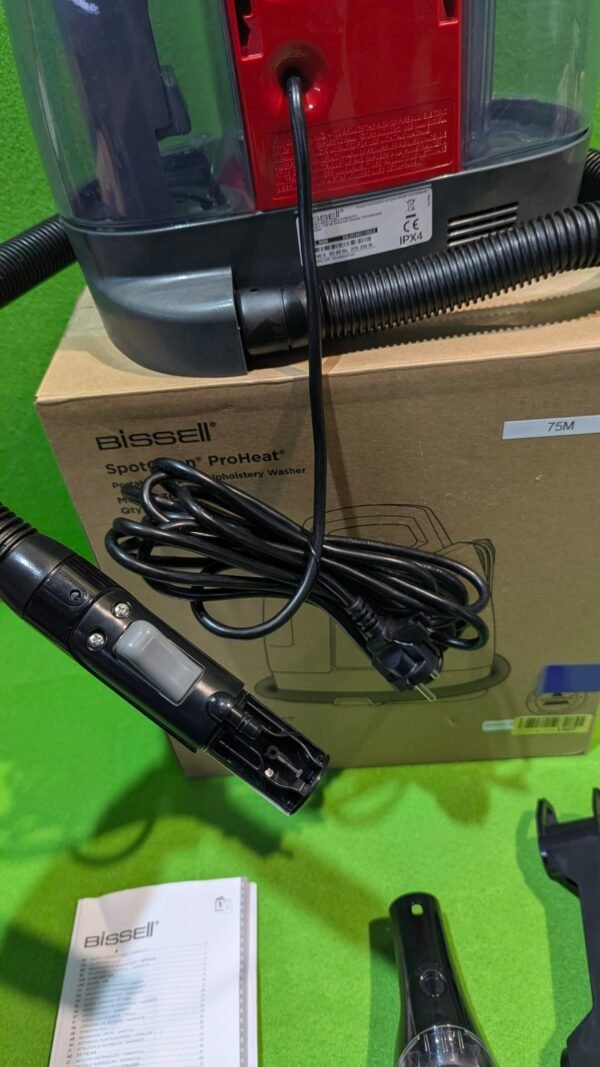 Aspiradora Bissell ProHeat con accesorios y manual.
